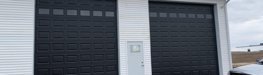 Black traditional garage doors with windows