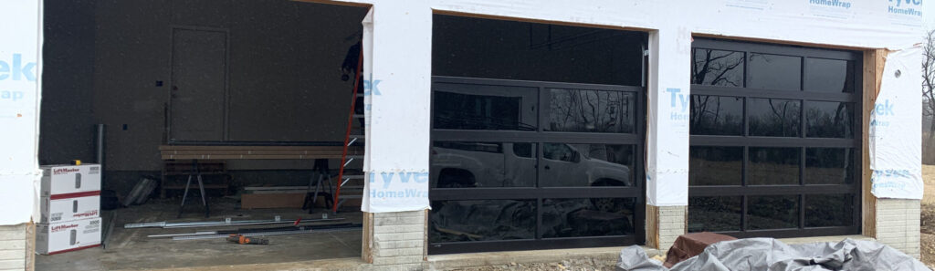 full view glass garage door being installed by Apex Garage Door