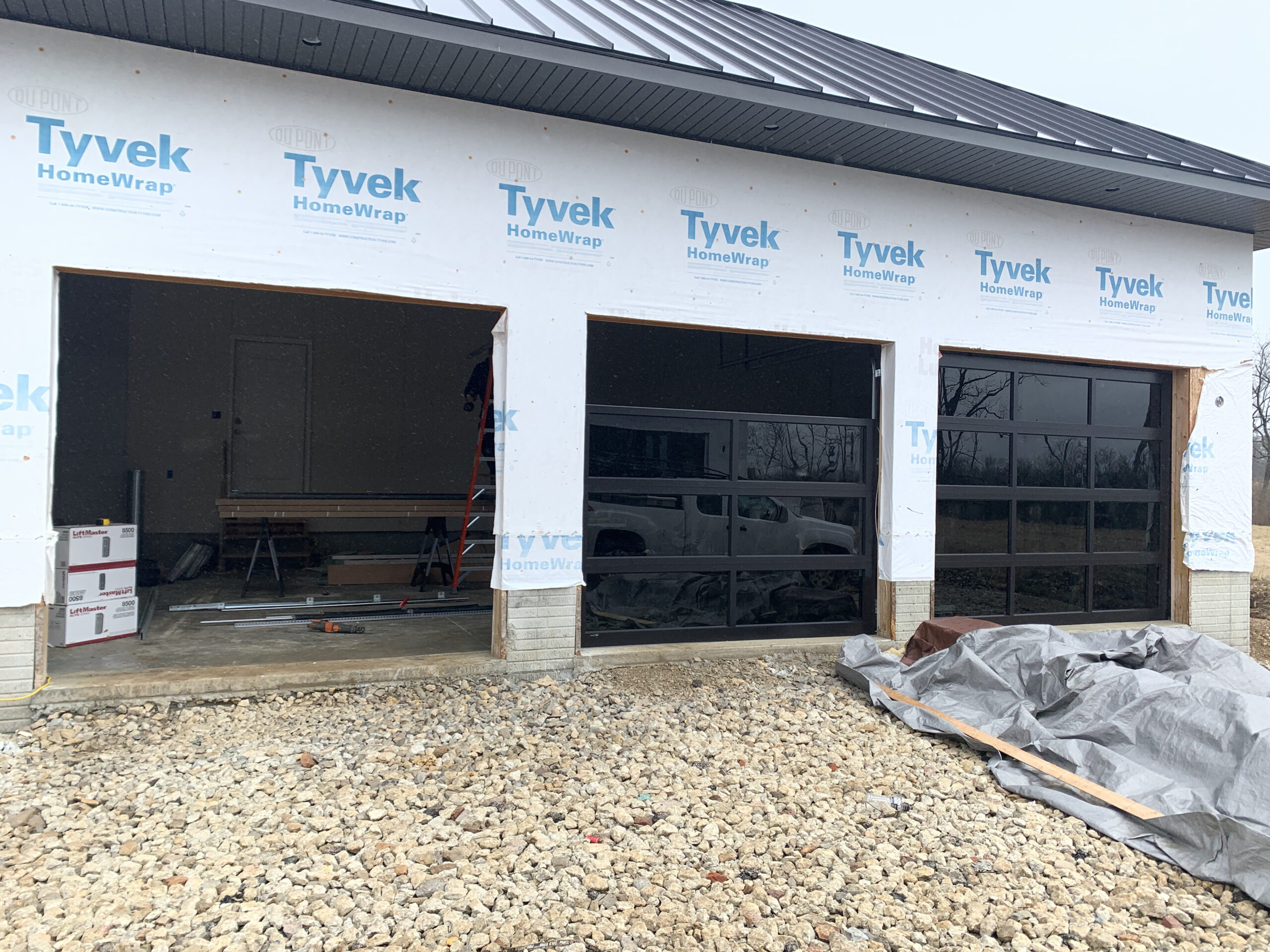 3 full-view garage doors are in the progress of being built.